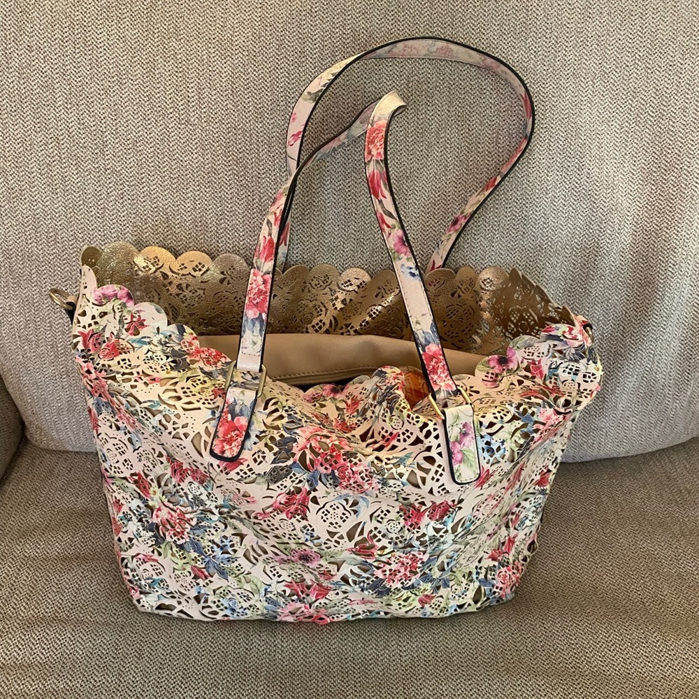Woman’s Aldo lace purse, tan, pink and blue